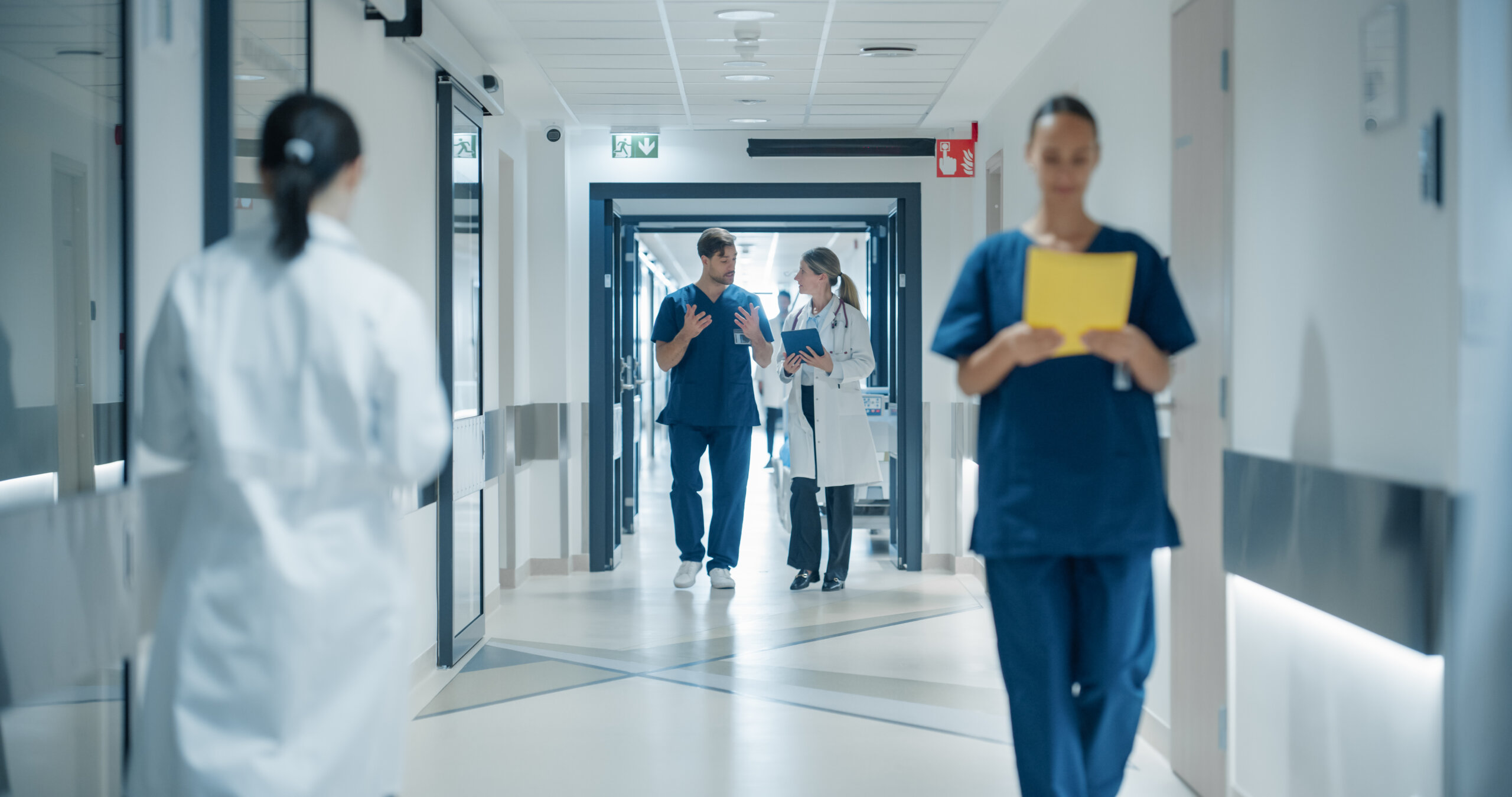 Healthcare workers in a hospital hallway